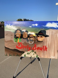 a painting of a group of people in front of a sign